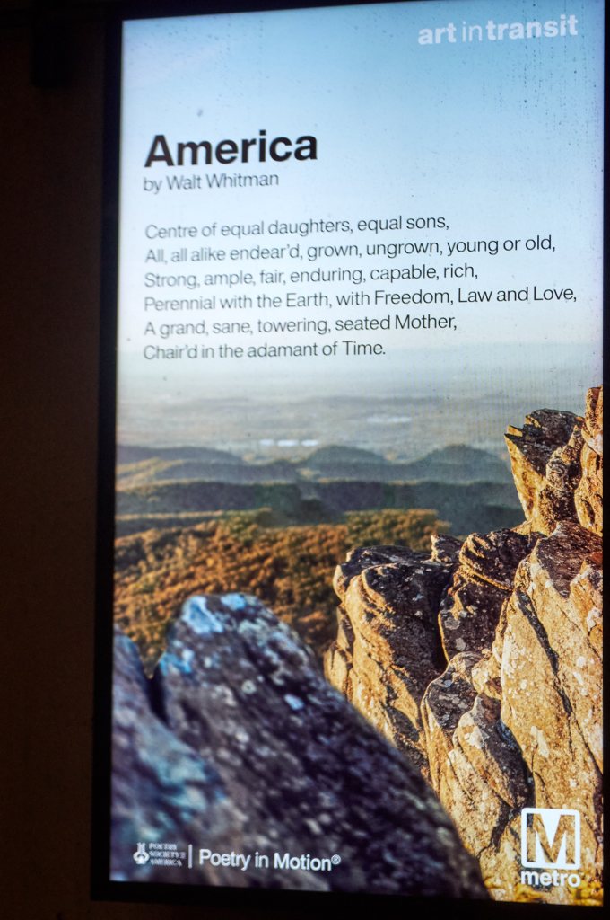 Metro Poetry in Motion panel with Walt Whitman's poem America