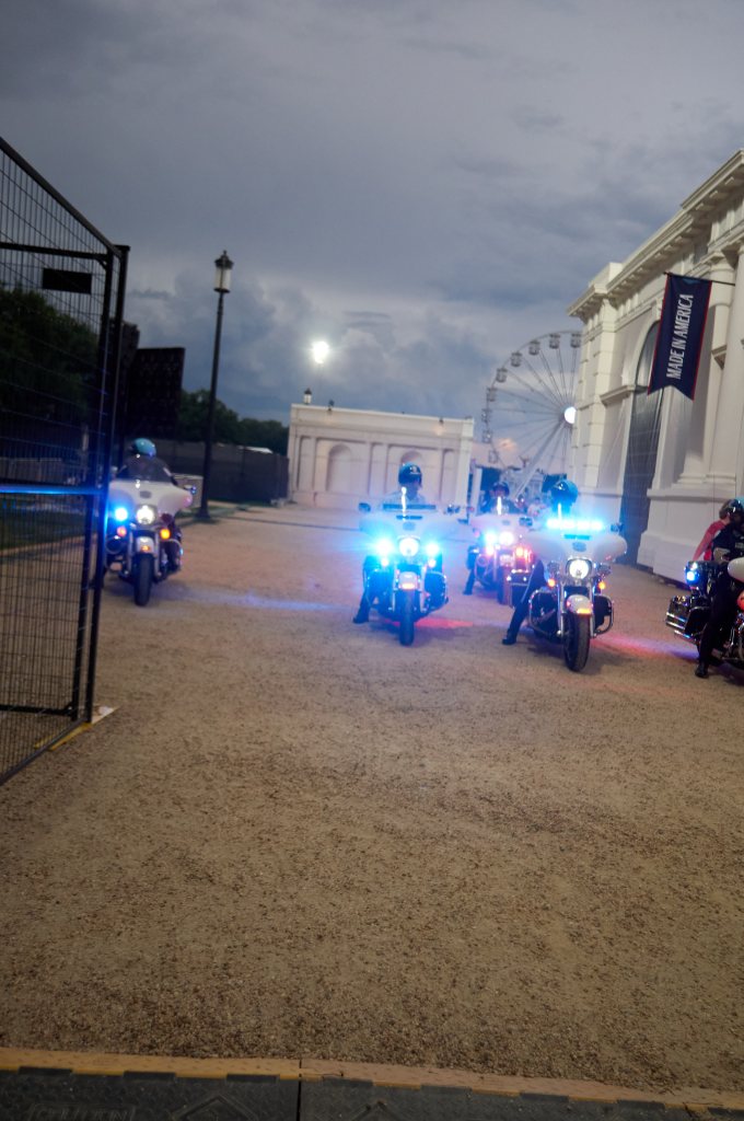 Police motorcycles with blue lights lined up side by side