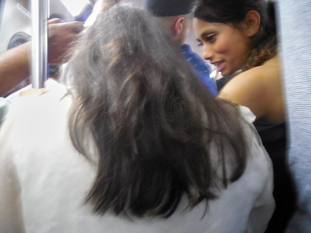 Riders crowded on a Metro train