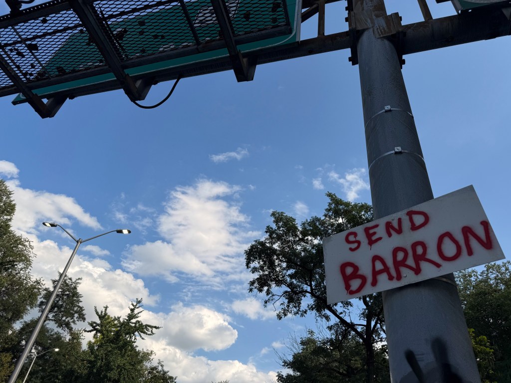 SEND BARRON sign on a signpost seen from below