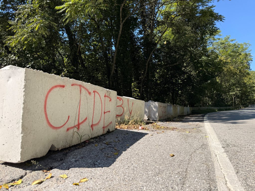 Adjacent barriers painted CIDE and BY