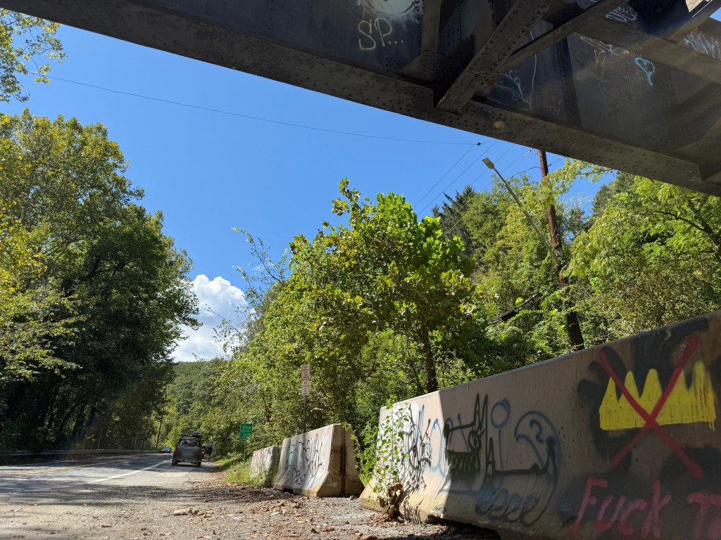 Crossed-out crown on a barrier facing traffic on Ilchester Road