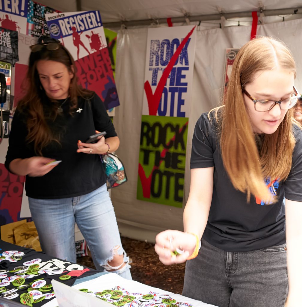 Volunteer sorting buttons at the Rock the Vote tent